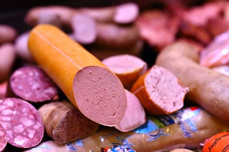 fresh sausage and meat in the bar for sale in the supermarketの写真素材