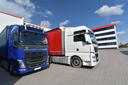 Trucks loading at a depot of a forwarding agency - Transport and logistics in goods tradeの写真素材