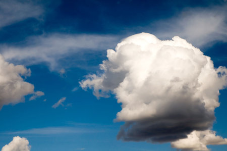 Puffy white clouds in a blue sky.