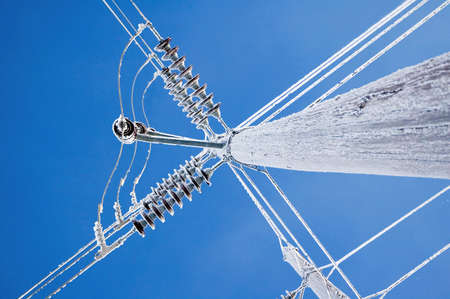 Hoar frost on a power pole and lines.の写真素材