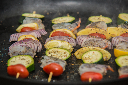 Barbeque sticks with meat and vegetables. の写真素材