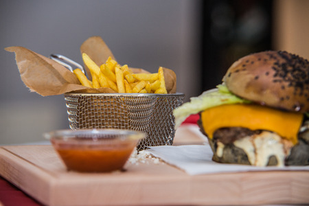 Sandwich hamburger with juicy burgers cheese and mix of vegetables.の写真素材