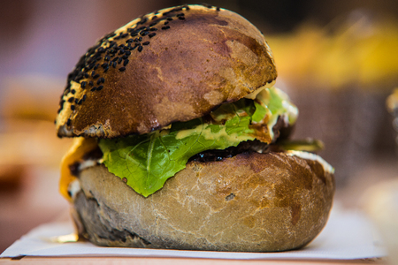 Sandwich hamburger with juicy burgers cheese and mix of vegetables.の写真素材