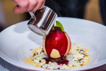 The chef in the kitchen prepares sweet dessert.の写真素材