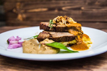 Food on a plate, on a wooden background.Food detail