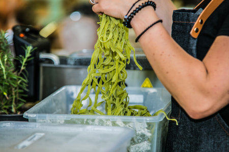 cooking chef prepares fresh homemade pasta from flour. Traditional italian cuisine