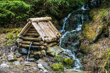 Natural source of spring water in forest. Beautiful landscape. Country Slovakiaの写真素材