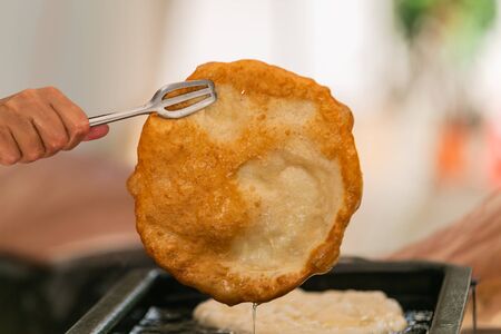 Close up hands of chef preparing food in the kitchen of a restaurant, cooking conceptの写真素材