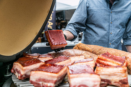 The chef prepares delicious roasted meat. Closeup of a fresh roasted meatの写真素材