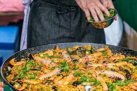 Close up hands of chef preparing food in the kitchen of a restaurant, cooking conceptの写真素材