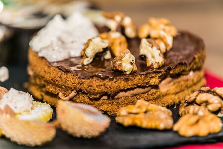 Cakes for christmas. Sweet cakes at a bakery for Christmas eve. Christmas winter food compositionの写真素材
