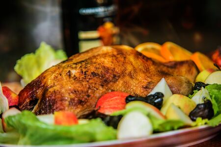 Roasted duck with vegetables, herbs, orange and apples. Food delicacy. Concept for food. Closeupの写真素材