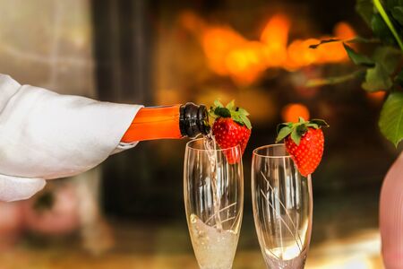 A glass with the champagne, decorated with a strawberry. Romantic composition with champagne and strawberryの写真素材