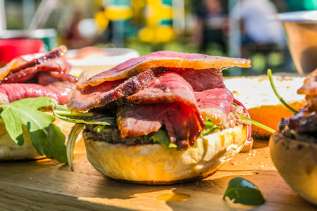 Sandwich hamburger with and mix of vegetables. Fast food. Delicious hamburger