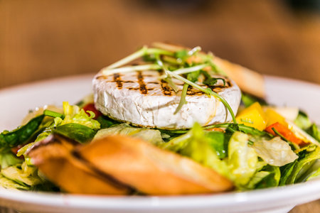 Fresh garden salad. Fresh garden salad on a plate. Fresh and healthy vegetable salad with cheese