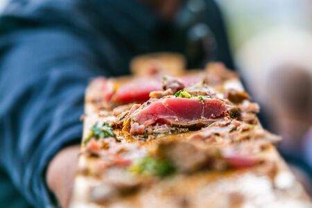 The chef prepares delicious roasted meat. Closeup of a fresh roasted meatの写真素材