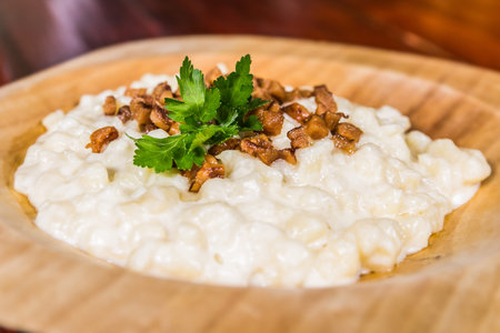 Slovak traditional food - bryndzovÃ© haluÅ¡ky.Potato gnocchi dumplings with sheep cheese and...