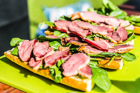 Baguettes with spinach and pork ham. The food in the restaurant. Food styling and restaurant meal...