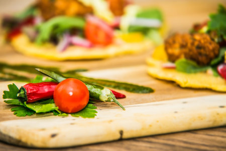 Close-up of a vegetable side dish on a wooden trayl. The food in the restaurant. Food styling and restaurant meal serving.の写真素材