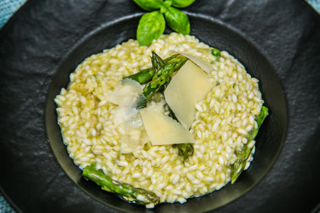 Risotto with asparagus and parmesan. The food in the restaurant. Food styling and restaurant meal serving.の写真素材