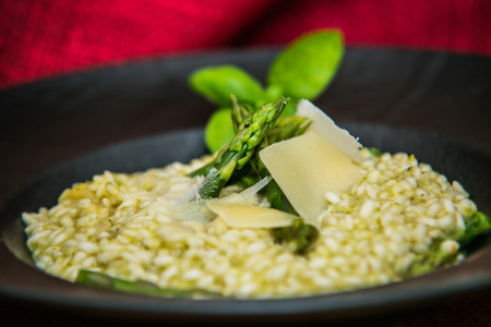 Risotto with asparagus and parmesan. The food in the restaurant. Food styling and restaurant meal serving.の写真素材