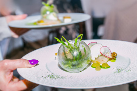 Glazed fish with lime mousse on a white plate. Food styling and restaurant meal serving.