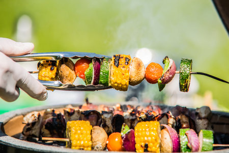 The chef prepares a vegetable grilled skewer. Closeupの写真素材
