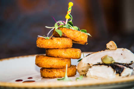 Potato ducats with chicken meat.The food in the restaurant. Food styling and restaurant meal serving.の写真素材