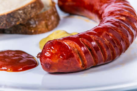 Roast pork sausage with bread and dressing. The food in the restaurant. Food styling and restaurant meal serving.の写真素材