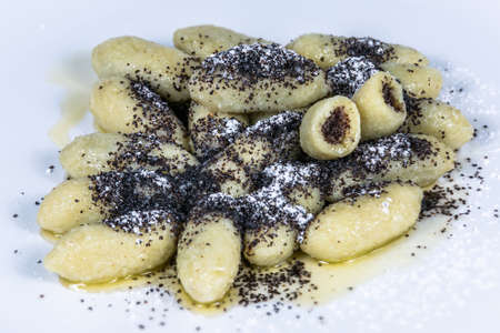 Potato noodles stuffed with poppy seeds. The food in the restaurant. Food styling and restaurant meal serving.の写真素材