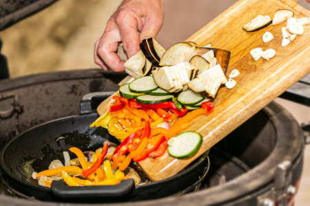 Chef prepares fresh vegetables on the grill. Close upの写真素材