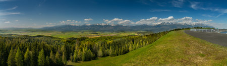 A view of the Cierny Vah hydroelectric power plant. High Tatras scenery. Monumental peaks over water...