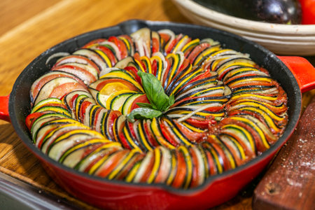 Chef preparing traditional ProvenÃ§al vegetable dish Ratatouille with stuffed rolled meat on the grill. French food. Healthy eating. Delicious vegetableの写真素材