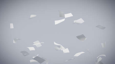 Flying sheets of white paper swirling in the air in a whirlwindの写真素材
