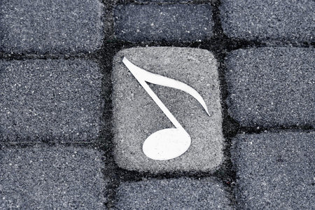 Music notes on the street, bacgrounds, black and grey.