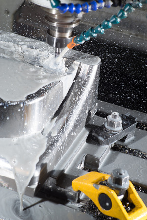 stop motion of CNC machining center milling a part of mould while using coolant.の写真素材