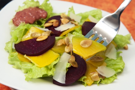 Pumpkin and beetroot salad with pumpkin seeds and cheeseの写真素材