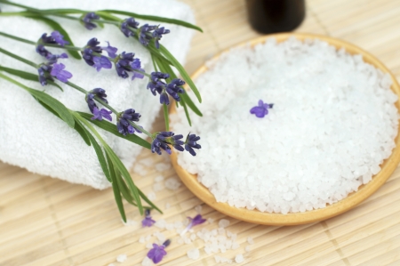 Bowl of bath salt with fresh lavender flowers, selective focusの写真素材