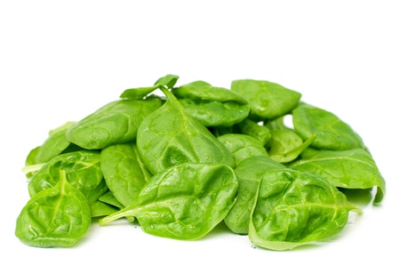 Pile of fresh spinach isolated on white, selective focusの写真素材