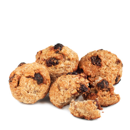 Homemade oatmeal cookies with nuts and strawberries isolated on whiteの写真素材