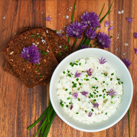 Organic rye bread with fresh chives and cottage cheese, square imageの写真素材