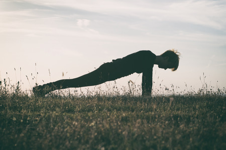 Yoga-Dandasana /Plank pose,intentionally toned image.の写真素材