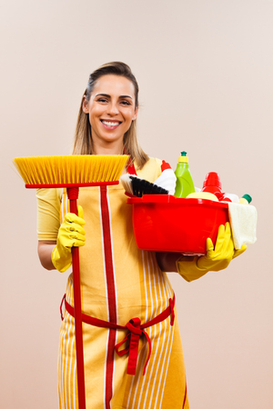 Portrait of beautiful housewife ready for cleaning.の写真素材