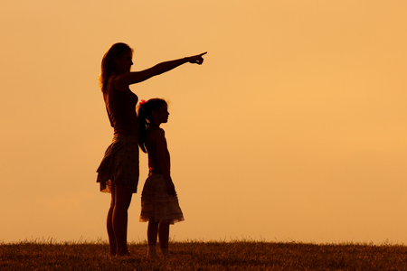Mother and daughter enjoy spending time together in nature.の写真素材