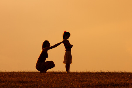Mother and daughter had a conflict and now mother consoling her angry daughter.の写真素材