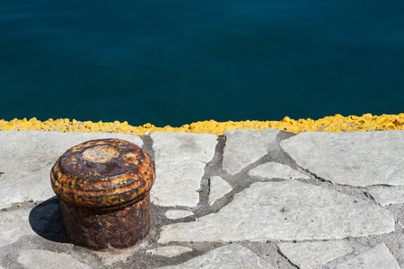 Image of old harbor cleat and beautiful dark blue sea.の写真素材