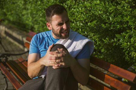 Young sporty man having sport injury.の写真素材