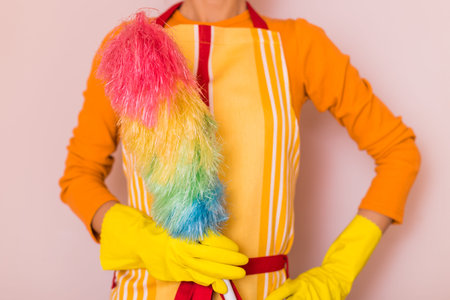 Image of housewife holding duster.の写真素材