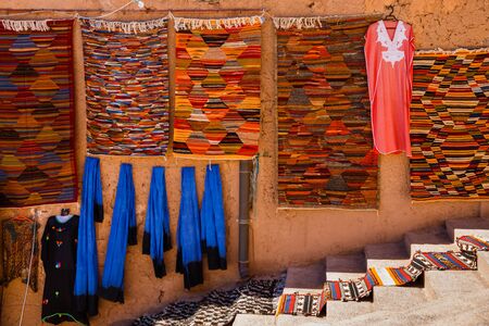 Image of traditional rugs and clothes in Moroccoの写真素材