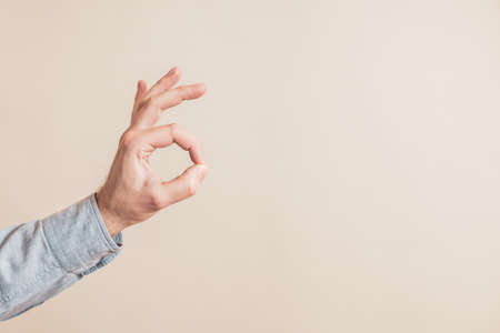 Close up image of male hand showing ok sign.の写真素材